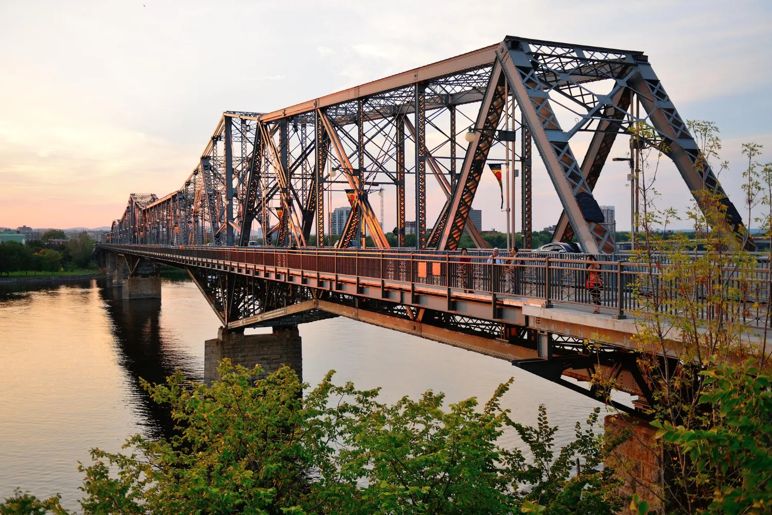 Steel truss bridge at sunset — civil engineering infrastructure